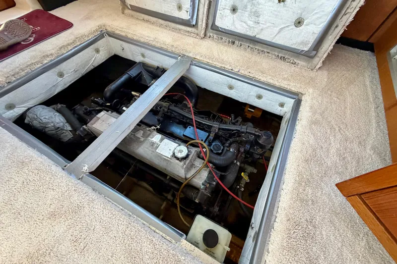 Slide: The Image of Engine compartment of a 1995 Bayliner 4788 Pilot House Motoryacht, showing detailed machinery. - 47