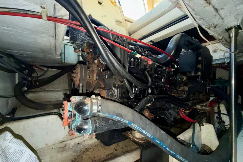 Slide: The Image of Engine room of 1995 Bayliner 4788 Pilot House Motoryacht with visible mechanical components. - 49
