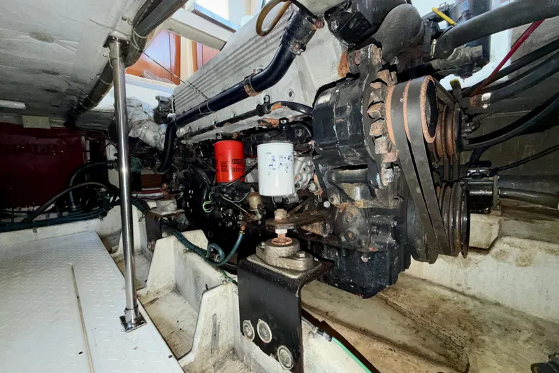 Slide: The Image of Engine room of 1995 Bayliner 4788 Pilot House Motoryacht, showcasing mechanical components. - 50