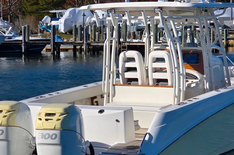 Slide: The Image of 2013 Boston Whaler 320 Outrage boat docked with dual 300 engines. - 7