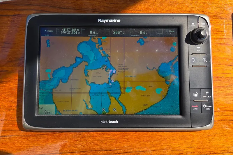 Slide: The Image of Raymarine GPS display on 2013 Boston Whaler 320 Outrage boat dashboard. - 19