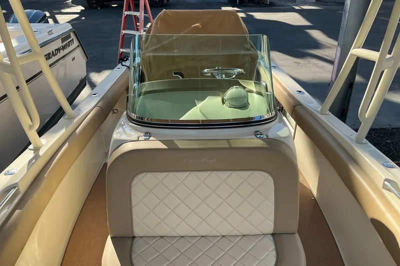Slide: The Image of 2016 Chris-Craft Catalina 23 boat interior with tan and white seating. - 11