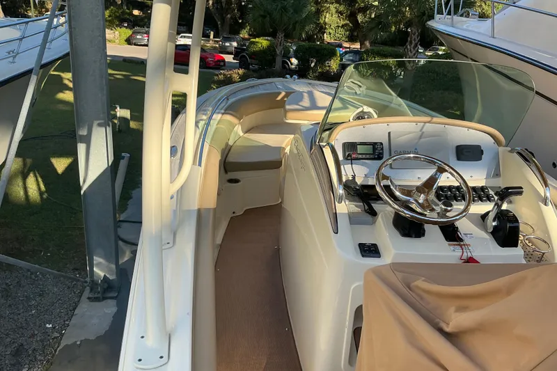 Slide: The Image of 2016 Chris-Craft Catalina 23 boat interior with steering wheel and control panel. - 14