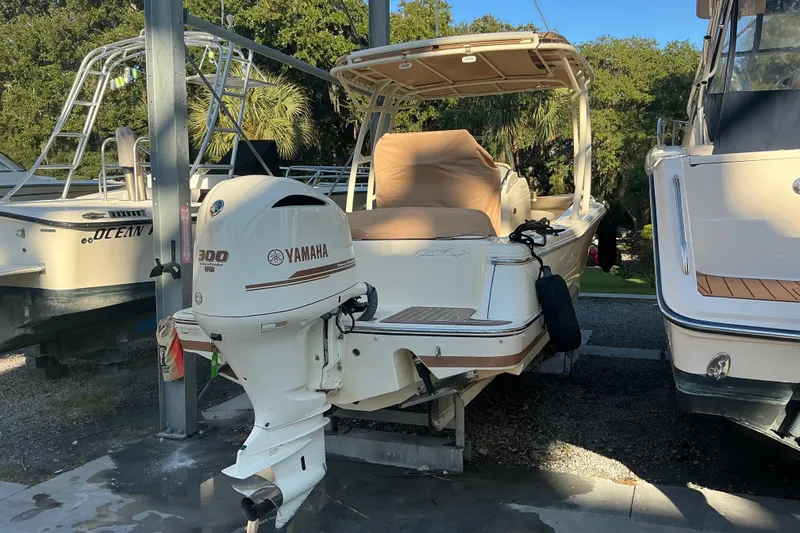 Slide: The Image of 2016 Chris-Craft Catalina 23 boat with Yamaha 300 engine, docked outdoors. - 18