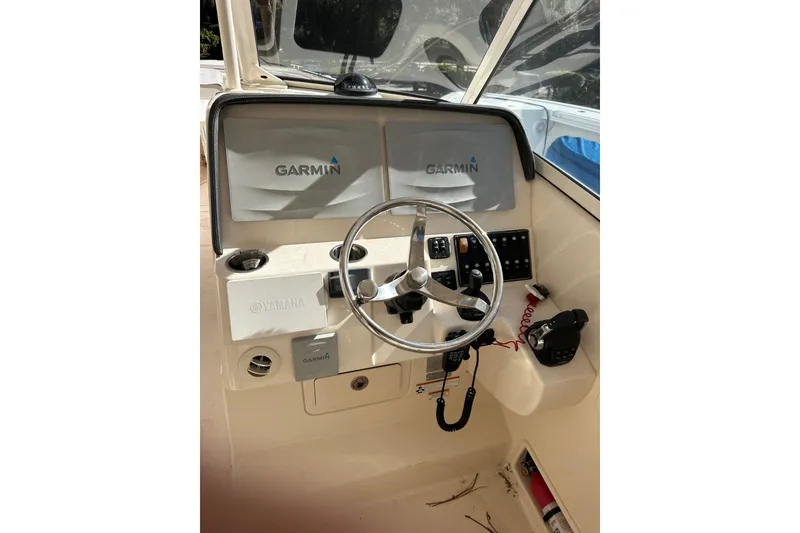 Slide: The Image of 2016 Chris-Craft Catalina 23 helm with Garmin displays and Yamaha controls. - 23