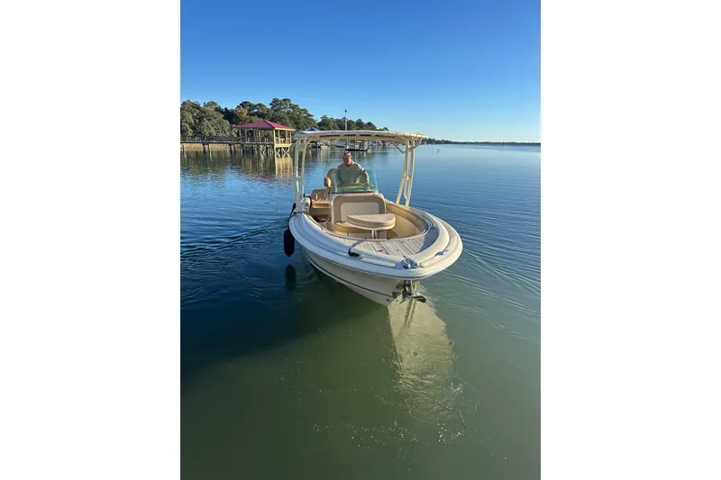Slide: The Image of 2016 Chris-Craft Catalina 23 boat on calm water, clear blue sky background. - 3