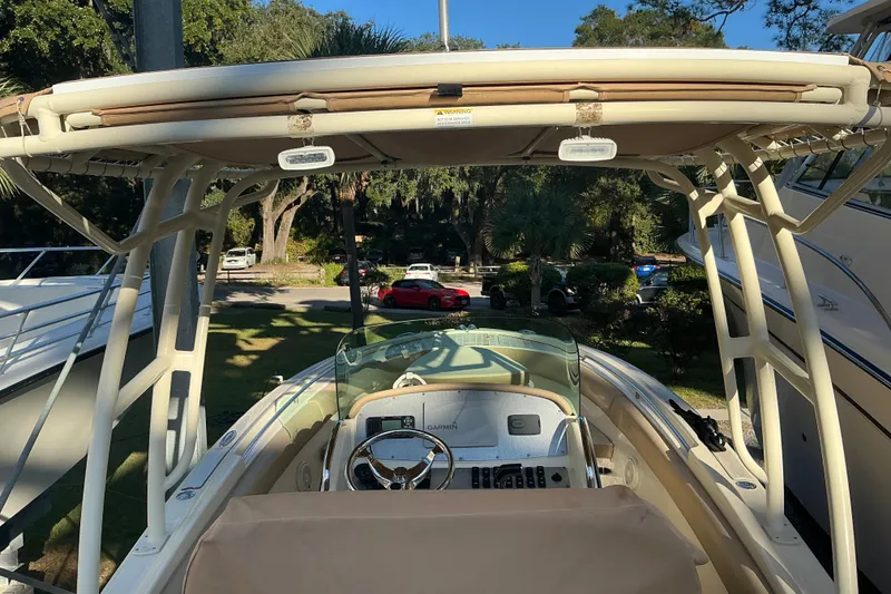 Slide: The Image of 2016 Chris-Craft Catalina 23 boat interior with steering wheel and canopy. - 9