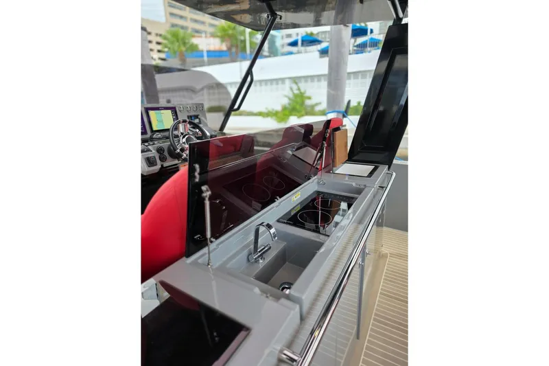 Slide: The Image of 2023 De Antonio Yachts D42 Open interior with modern kitchen and navigation controls. - 10