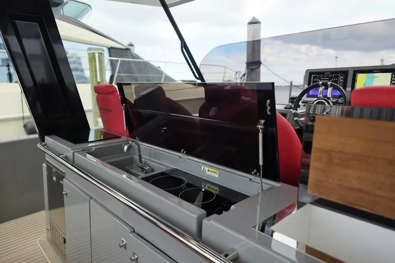 Slide: The Image of 2023 De Antonio Yachts D42 Open interior with modern kitchen and navigation controls. - 11