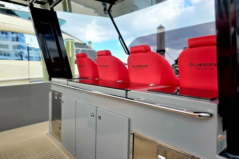 Slide: The Image of 2023 De Antonio Yachts D42 Open with red seating and sleek design. - 2