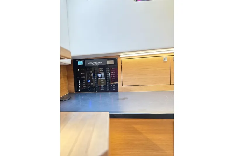 Slide: The Image of Control panel of 2023 De Antonio Yachts D42 Open, featuring modern design and wood accents. - 20