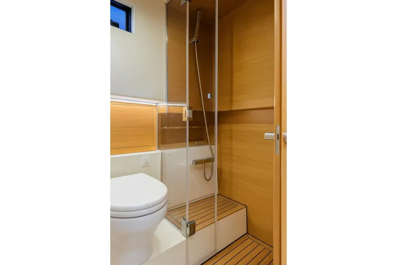 Slide: The Image of Modern bathroom in 2023 De Antonio Yachts D42 Open, featuring sleek wood paneling and glass shower. - 23