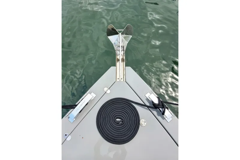 Slide: The Image of Bow of 2023 De Antonio Yachts D42 Open with anchor and coiled rope. - 25
