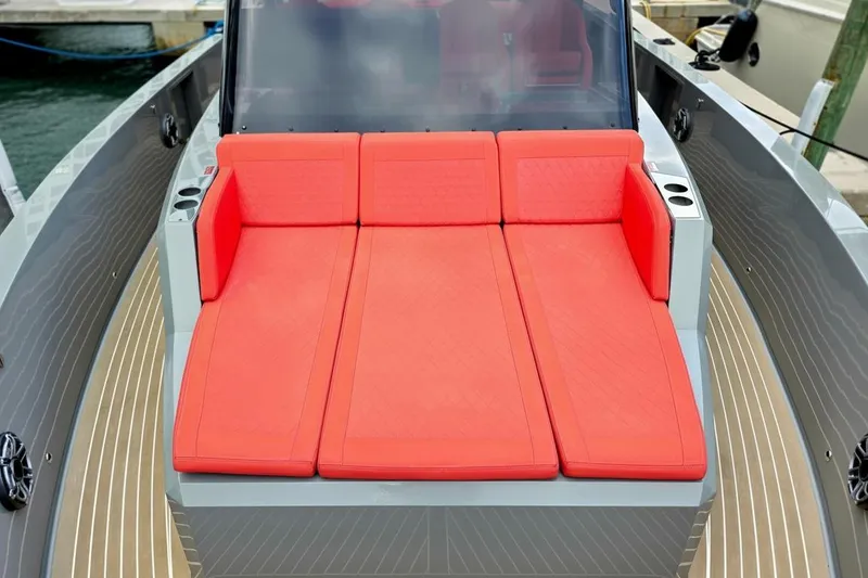 Slide: The Image of 2023 De Antonio Yachts D42 Open with vibrant red seating on deck. - 26
