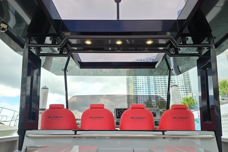 Slide: The Image of 2023 De Antonio Yachts D42 Open with red seats and modern helm station. - 3