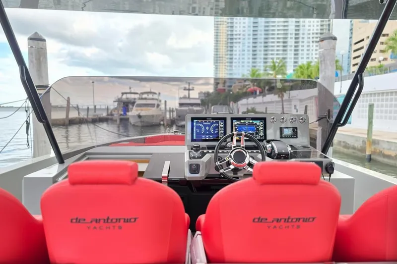 Slide: The Image of 2023 De Antonio Yachts D42 Open cockpit with red seats and modern navigation controls. - 8