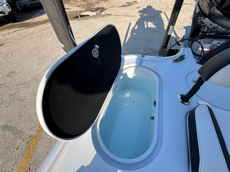 Slide: The Image of 2025 Yellowfin 24 CE boat with open storage compartment on deck. - 22