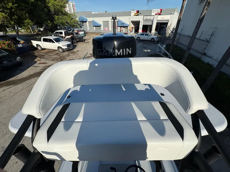 Slide: The Image of 2025 Yellowfin 24 CE boat with Garmin equipment, parked in an urban setting. - 23