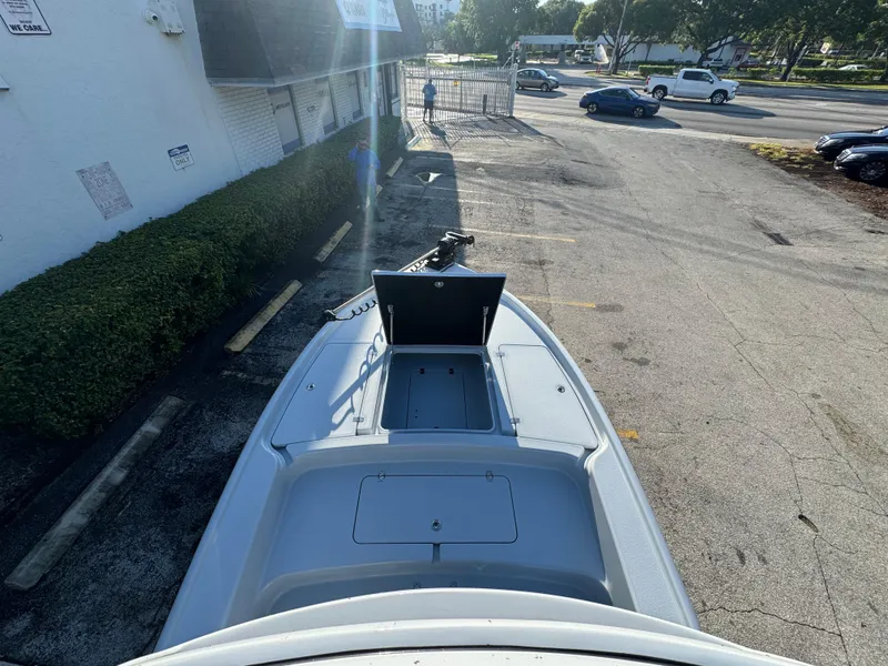 Slide: The Image of 2025 Yellowfin 24 CE boat parked in a lot, viewed from above. - 24