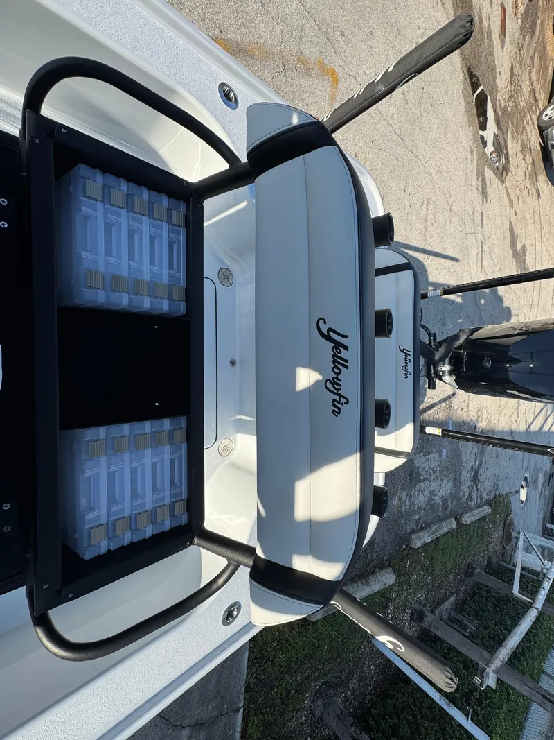 Slide: The Image of 2025 Yellowfin 24 CE boat, rear view, showcasing sleek design and branding. - 28