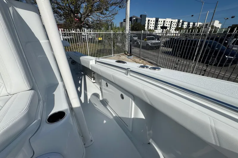 Slide: The Image of 2026 Yellowfin 26 Hybrid boat interior with white seating and sleek design. - 15