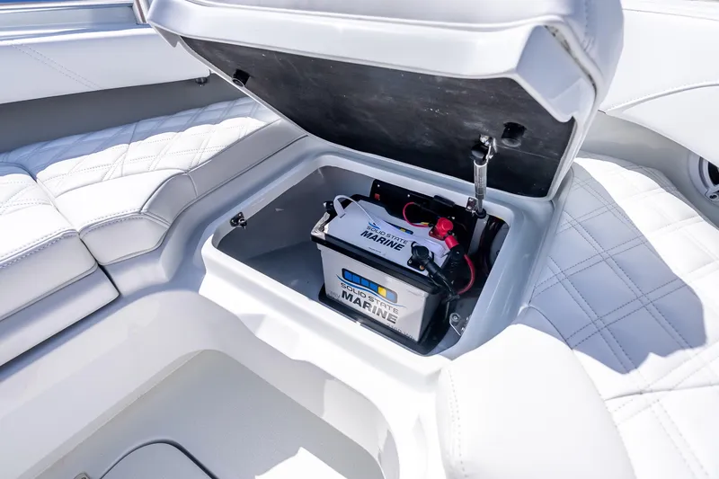 Slide: The Image of 2026 Yellowfin 26 Hybrid boat with marine battery storage under cushioned seat. - 34