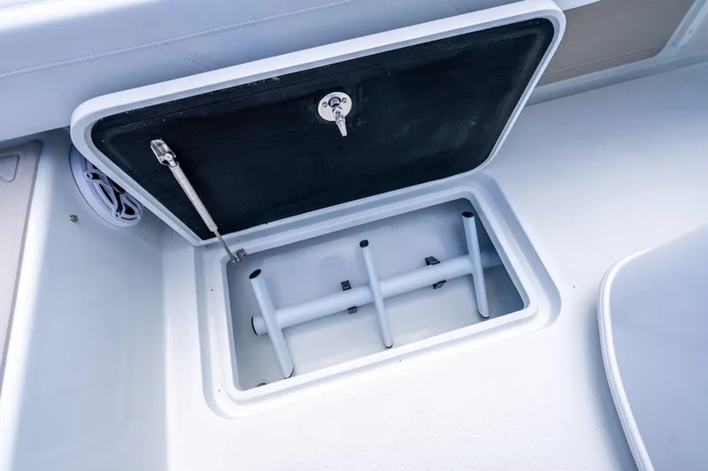 Slide: The Image of Open storage compartment on 2026 Yellowfin 26 Hybrid boat deck. - 38