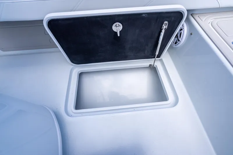 Slide: The Image of Open storage compartment on 2026 Yellowfin 26 Hybrid boat deck. - 39