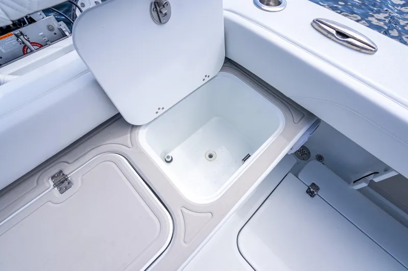 Slide: The Image of 2026 Yellowfin 26 Hybrid boat storage compartment with open hatch, showcasing interior design. - 41
