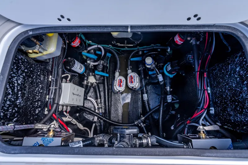 Slide: The Image of Engine compartment of 2026 Yellowfin 26 Hybrid boat, showcasing wiring and components. - 42