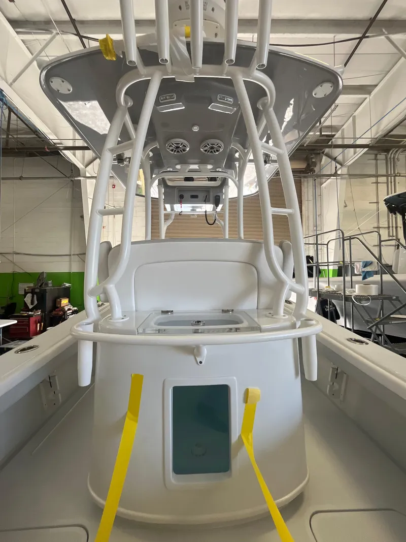 Slide: The Image of 2026 Yellowfin 26 Hybrid boat interior with storage compartment and sleek design. - 8