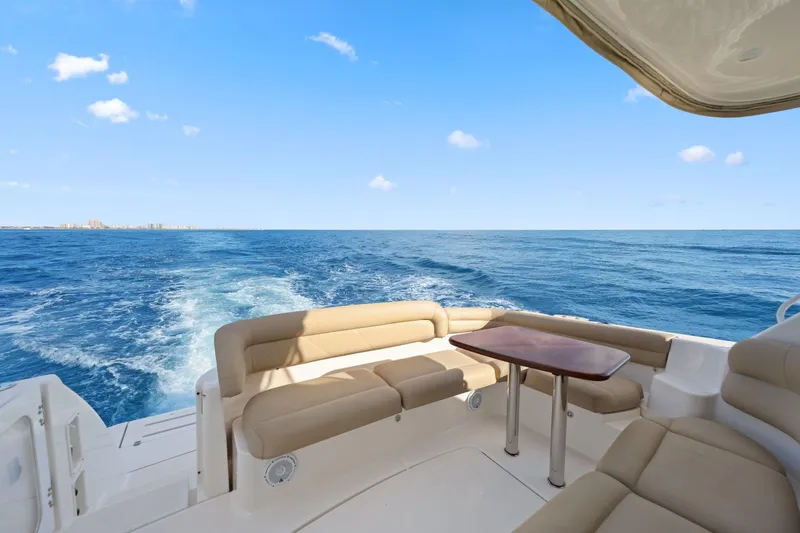 Slide: The Image of 2008 Tiara Yachts 4300 Sovran, luxurious deck view, cruising on open sea. - 16