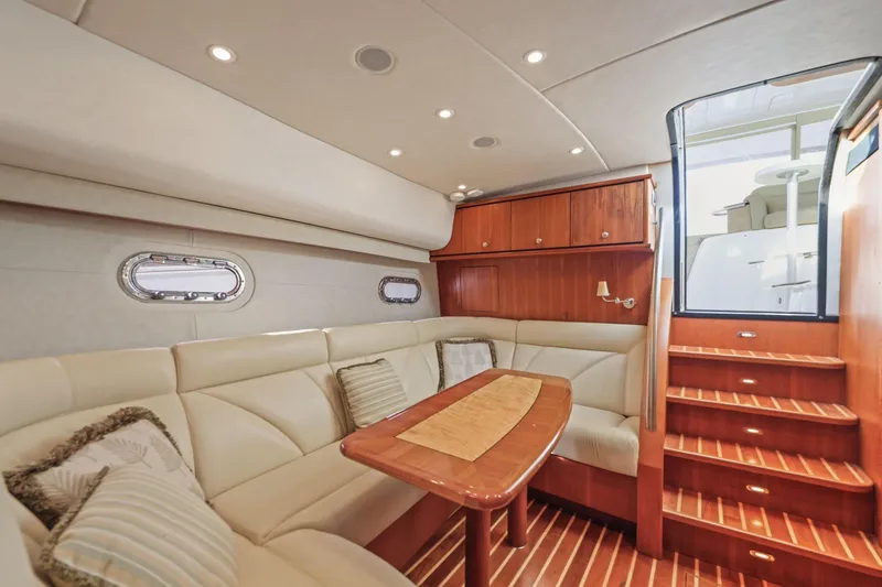 Slide: The Image of Luxurious interior of 2008 Tiara Yachts 4300 Sovran with elegant seating and wooden accents. - 32