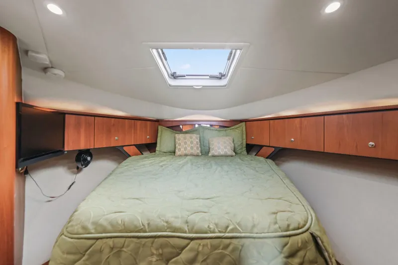 Slide: The Image of Luxurious cabin interior of 2008 Tiara Yachts 4300 Sovran with cozy bedding. - 33