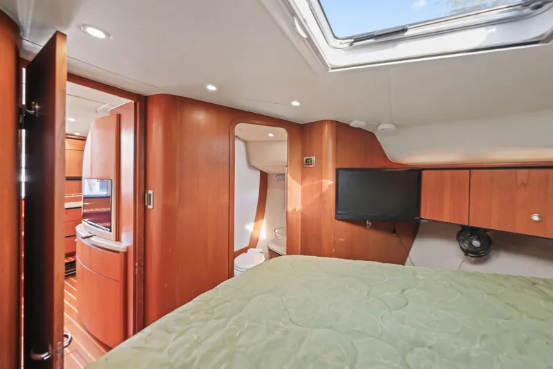 Slide: The Image of 2008 Tiara Yachts 4300 Sovran interior cabin with wood finish and modern amenities. - 34