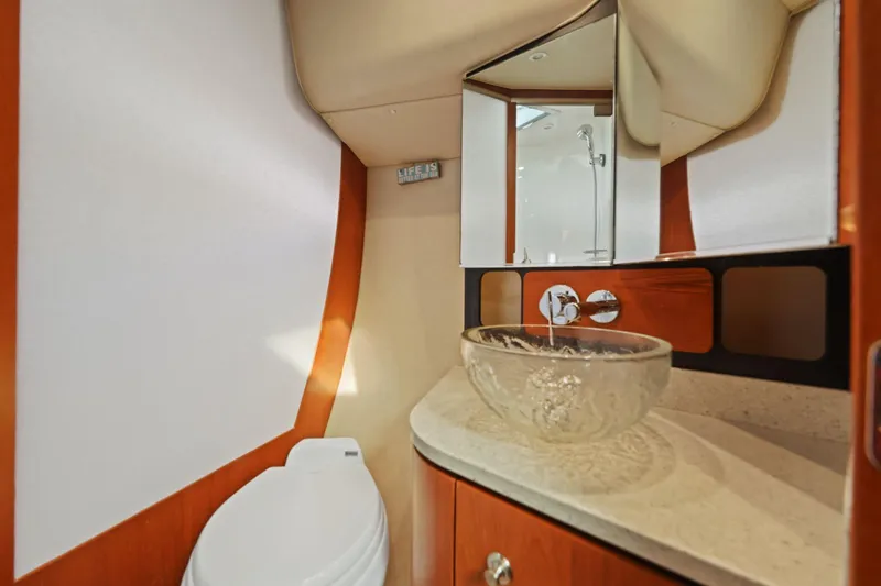 Slide: The Image of Luxurious bathroom in 2008 Tiara Yachts 4300 Sovran with glass sink and modern fixtures. - 35