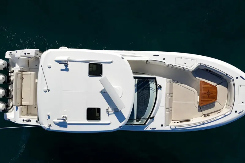Slide: The Image of Overhead view of 2022 Boston Whaler 380 Realm boat on water. - 13