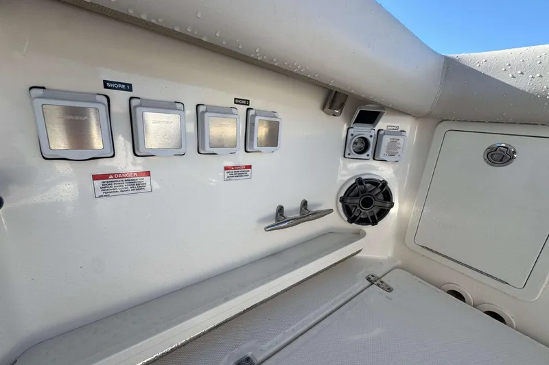 Slide: The Image of Boston Whaler 380 Realm 2022 boat electrical panel and speaker detail. - 20