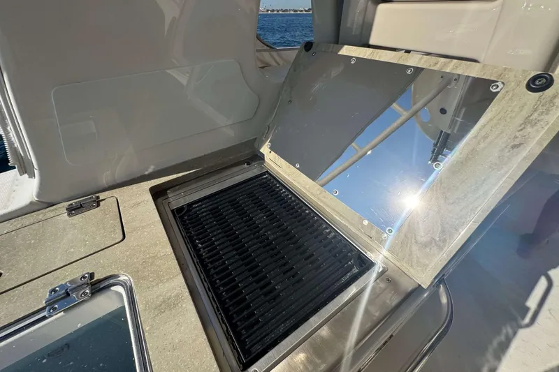 Slide: The Image of Outdoor grill on 2022 Boston Whaler 380 Realm boat, featuring sleek design and stainless steel finish. - 22