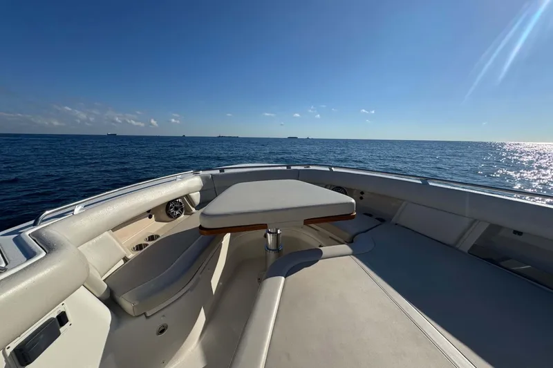 Slide: The Image of 2022 Boston Whaler 380 Realm boat deck with ocean view under clear blue sky. - 24