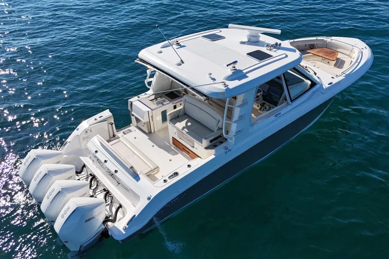 Slide: The Image of 2022 Boston Whaler 380 Realm boat on clear blue water, aerial view. - 3