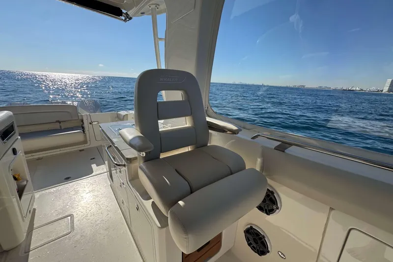 Slide: The Image of 2022 Boston Whaler 380 Realm interior with ocean view, featuring luxurious seating. - 35