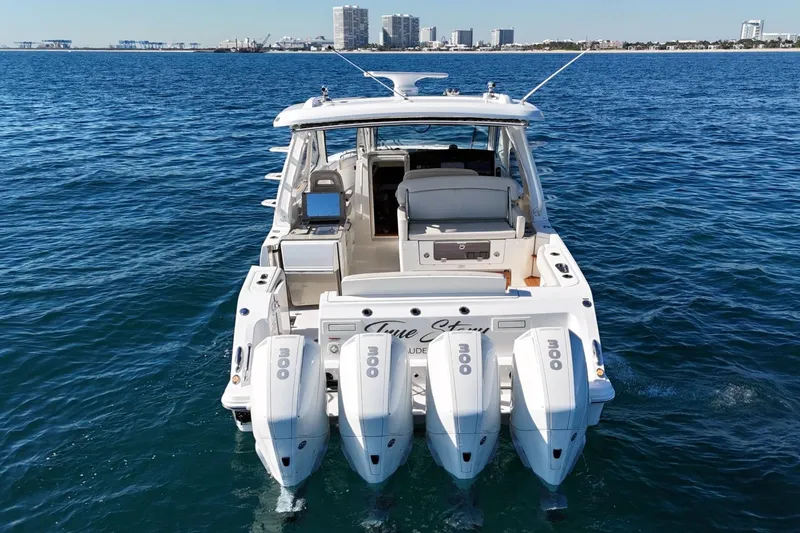 Slide: The Image of 2022 Boston Whaler 380 Realm boat with four engines on open water. - 6
