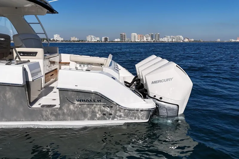 Slide: The Image of 2022 Boston Whaler 380 Realm boat with Mercury engines on open water. - 7