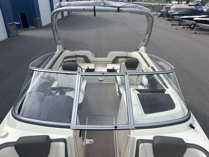 Slide: The Image of 2015 Yamaha AR242 Limited boat with open cockpit and gray seating. - 26