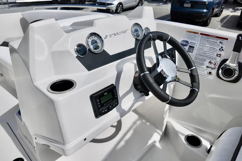 Slide: The Image of Steering console of 2026 Starcraft SVX 171 OB boat with gauges and controls. - 12