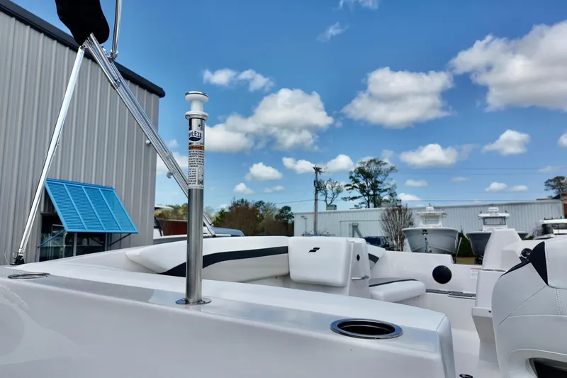 Slide: The Image of 2026 Starcraft SVX 171 OB boat, sleek design, outdoor setting, blue sky, modern features. - 16