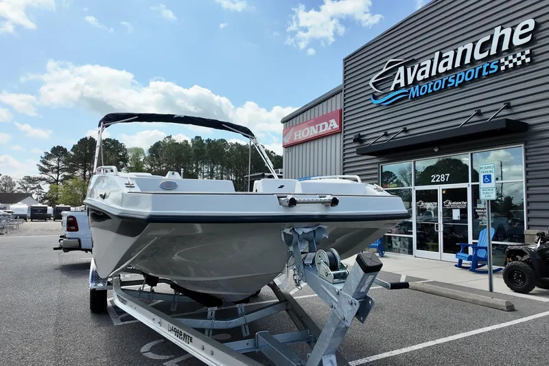 Slide: The Image of 2026 Starcraft SVX 171 OB boat on trailer at Avalanche Motorsports dealership. - 4