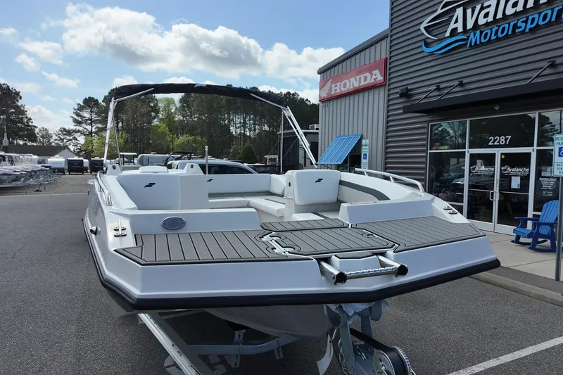 Slide: The Image of 2026 Starcraft SVX 171 OB boat displayed at dealership, featuring sleek design and spacious seating. - 5