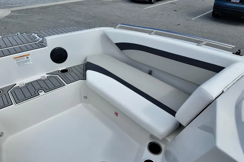 Slide: The Image of 2026 Starcraft SVX 171 OB boat interior with cushioned seating and cup holders. - 7